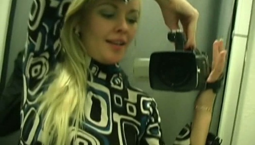 Nude blonde posing in front of the mirror porn pics