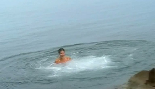 Nudist Dasha is having fun on a beach porn pics