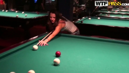 Cute brunette girl Nickel is playing games in a pub porn pics