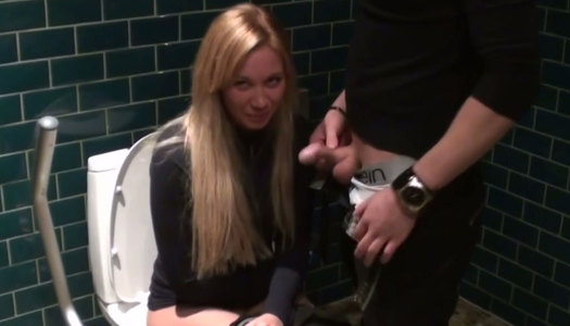 Busty blondie Lindsey gives a blowjob while sitting on toilet bowl porn pics