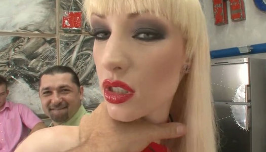 Dirty looking slut  in red pantyhose sucks two dongs porn pics