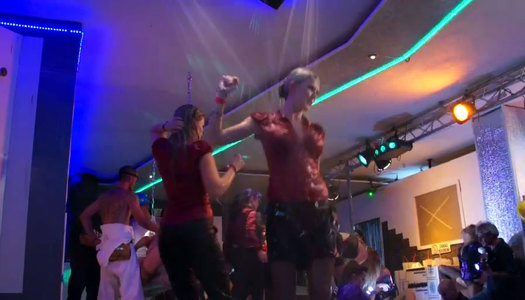 Slutty bitches are having fun on a stage in the club porn pics