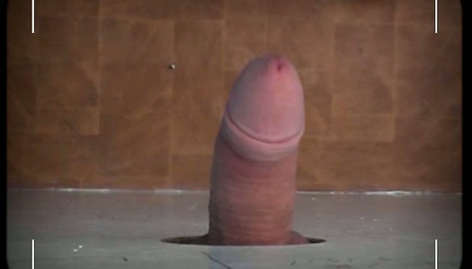 Red-haired slut Amy sucks cock through the glory hole porn pics