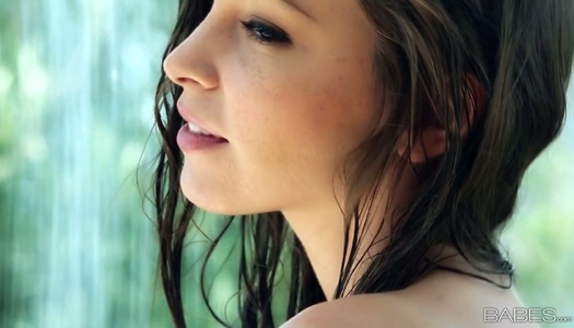 Seductive brunette in blue bikini Amber Sym takes a shower and poses naked porn pics