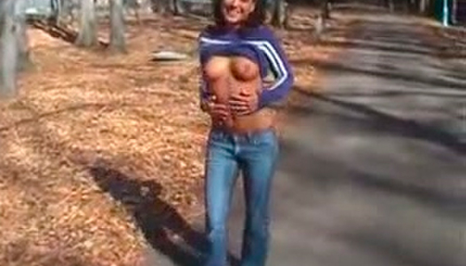 Playful brunette flashes her ass in public and gives her head deep in the forest porn pics