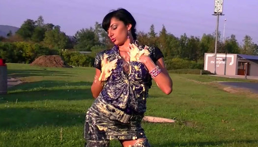 Kinky fully clothed brunette covers her body, face and legs with cream porn pics