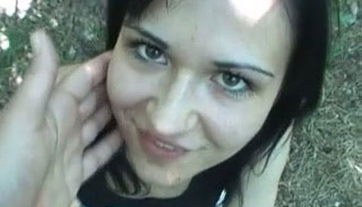 Brunette with charming eyes gives blowjob outdoor porn pics