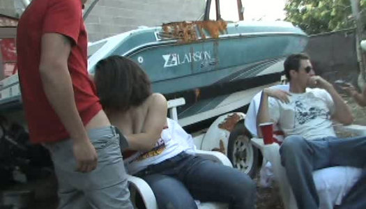 Slutty college student is sucking cock outdoor in front of coeds porn pics