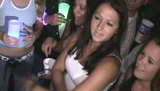 Skanky blonde college girl is fucking hard in front of a whole bunch of voyeurs porn pics