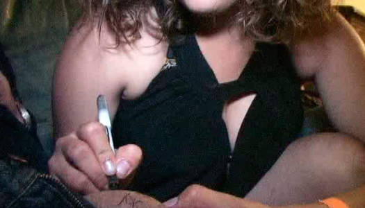 Curly-haired college slut signs her name on her friend's dick porn pics