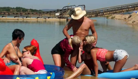 Crowd of spoiled bitches give simultaneous blowjob to aroused dude outdoor porn pics