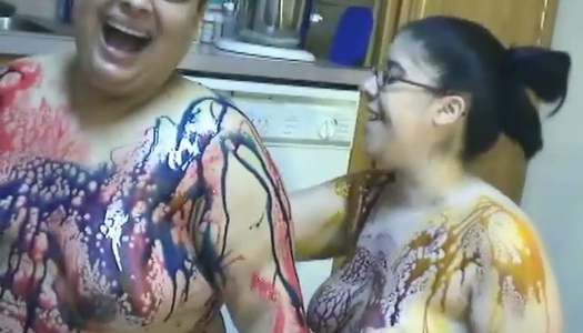 BBW lesbian girls gets messy in chocolate syrup in the kitchen porn pics