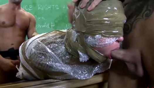Trashy whore is wrapped with plastic tape in wicked MMF threesome fuck scene porn pics