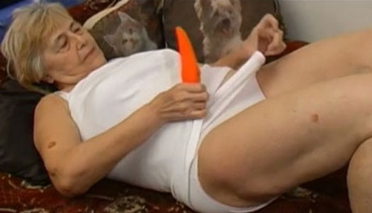 Filthy granny is playing with her loose pussy using smooth sex toy porn pics