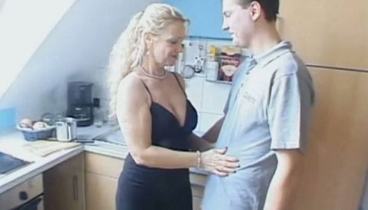 Torrid light haired mommy with giant boobs pleases her boy with solid BJ at kitchen porn pics