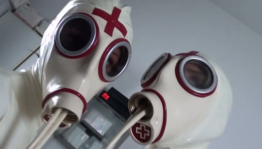 Two latex lesbians touch each others pussies and masturbate on a gynochair porn pics