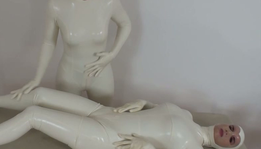 Two white latex babes fondle each other and stroke latex bodies porn pics