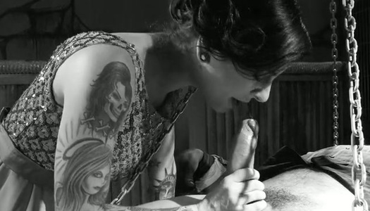 Heavily tattooed bitchy wench pleases her chained man with solid BJ porn pics