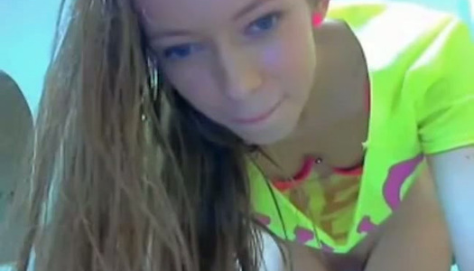 This camgirl has charming blue eyes and she loves fingering her pussy porn pics