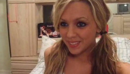 Cute bright blondie with pigtails undresses and flashes her shaved pussy porn pics