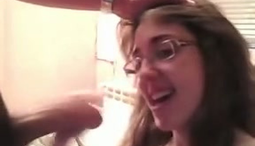 Cute nerdy brunette takes messy facial after giving blowjob porn pics