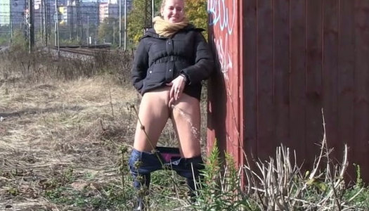 Dumpy brunette chick pisses near rail-track outdoors porn pics