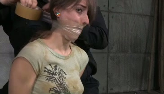 Tied up and restrained brunette teen gets punished in bdsm room porn pics