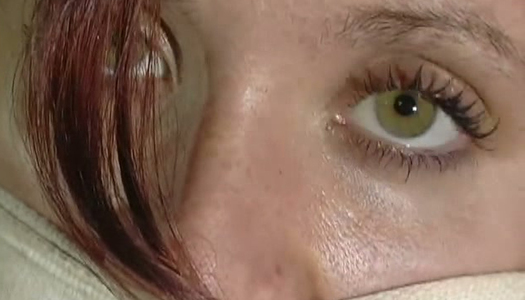 Red haired actress with pierced nipples is spanked in the dark room porn pics