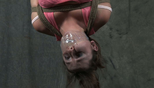 Bootyful chick is tied up and suspended before punishment porn pics