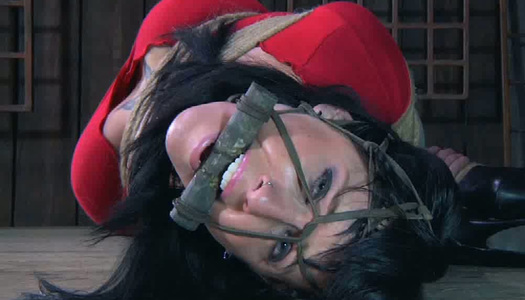 Tied up big breasted brunette has to stand still in the middle of the room porn pics