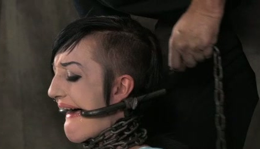 Chained and tied up slut is sitting on the floor porn pics