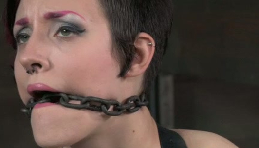 Chained and belted bitch with pink hair is ready for punishment porn pics