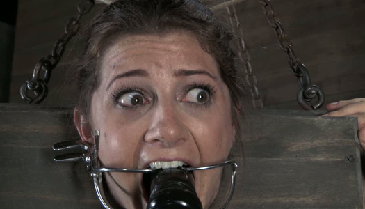 Locked in the wooden box all naked submissive brunette has to suck dildo porn pics