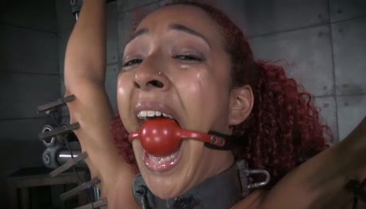 Slender moaning and titless ebony redhead gets fucked with some toys porn pics