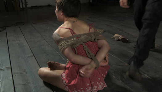 Hard tied cute brunette is sitting on the cold floor porn pics