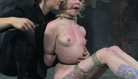 Tattooed blonde chick restrained in tormented in BDSM clip porn pics