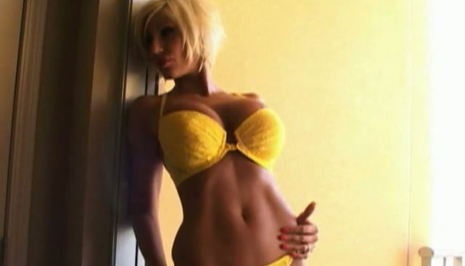 Short haired blond haired bimbo poses in her yellow bikini in doorjamb porn pics