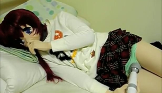 Kinky Asian girl in fancy mask lies in bed and rubs her clit with vibrator porn pics