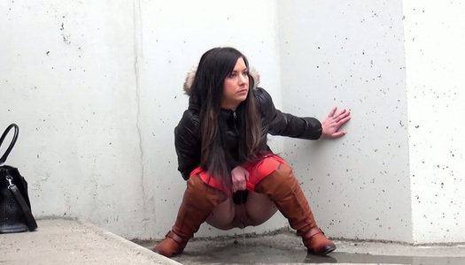 Lewd chick is frozen and wanna pee outdoors on the city road porn pics