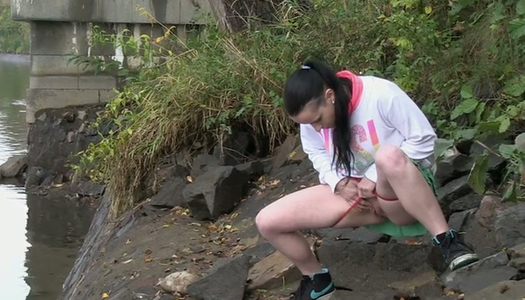 Dark haired filthy hottie loves pissing under the bridge porn pics