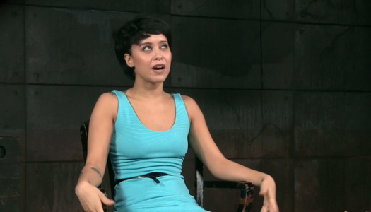 Short haired brunette in blue dress loves BDSM and role playing porn pics