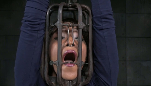 Bald headed sex slave is cuffed and punished in the dungeon porn pics