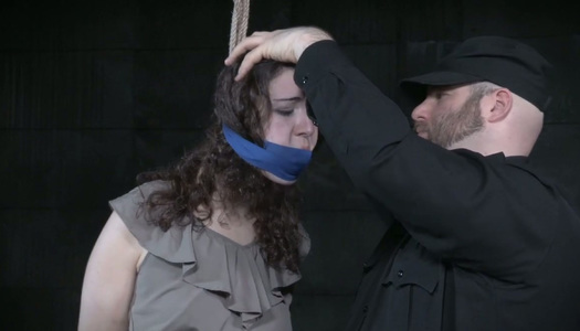 Tied up chick is punished by kinky master in torture room porn pics