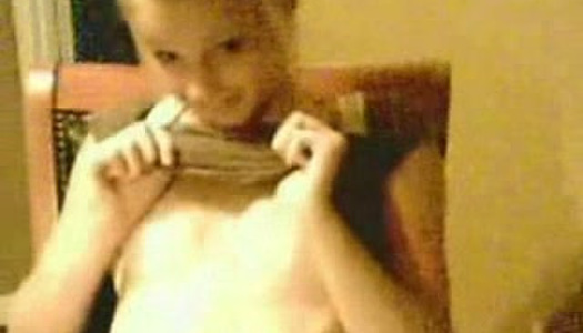 Small tittied blonde gal fingering her pussy sensually in solo video porn pics