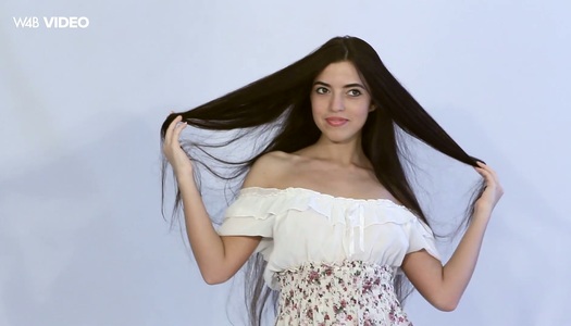 Long haired brunette Anna D is stripping and playing with her awesome pussy porn pics