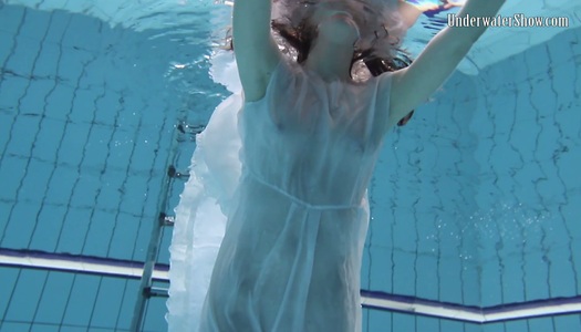 Sensual hottie in white dress Andrejka is swimming under the water porn pics