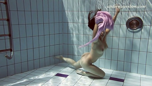 Charming curly babe Paulinka shows striptease under the water porn pics