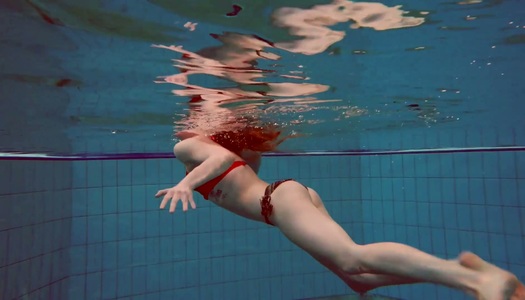 Sweet looking swimmer Katrin Bulbul is striping under the water porn pics