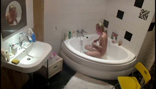 A hidden cam video tapes how Lisa is taking shower porn pics