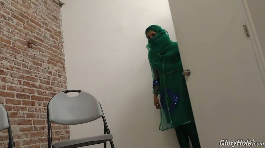 Hot Pakistani chick Nadia Ali sucks big dick in the glory hole room - 2. pic